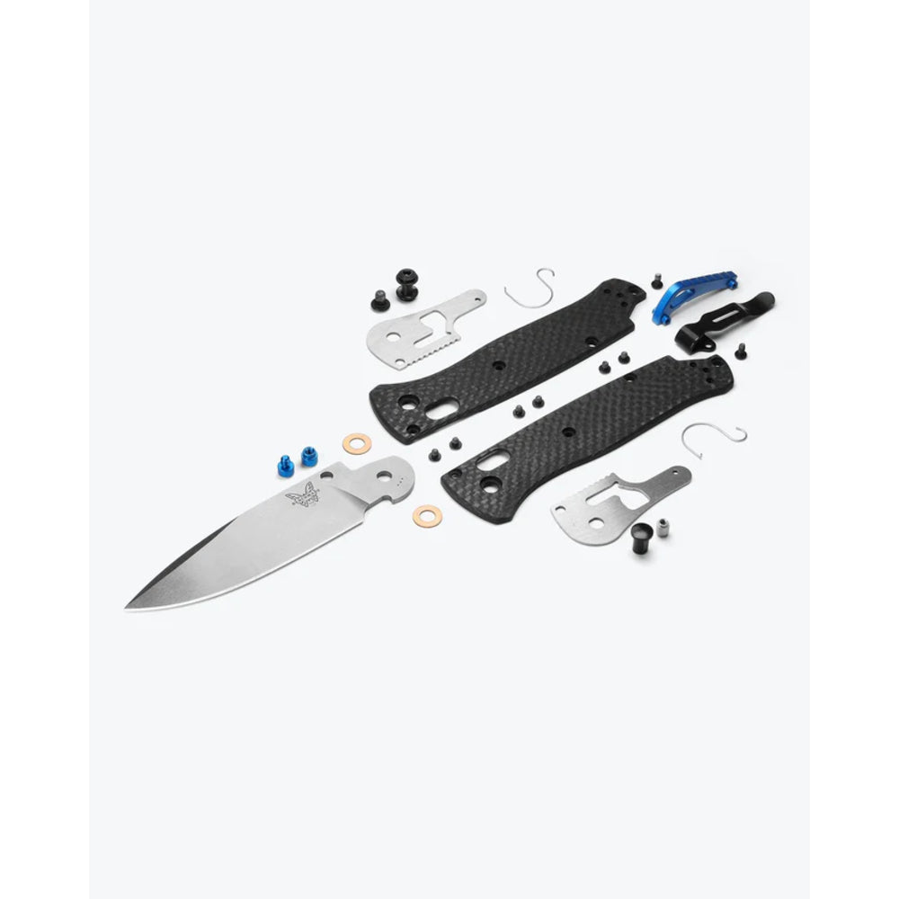 Knife assembly kit with blade and multiple components on a white background