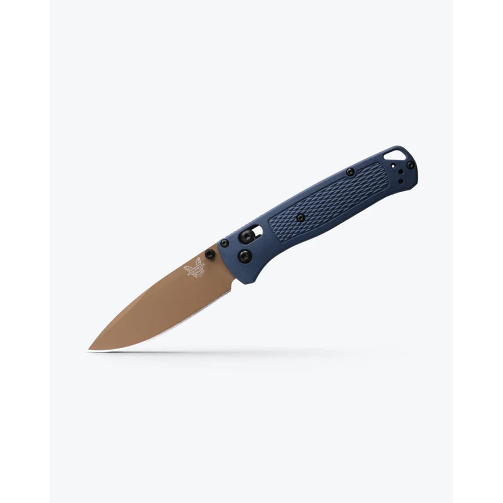 A folding pocket knife with a textured dark blue handle and a matte tan blade, shown open against a light gray background.
