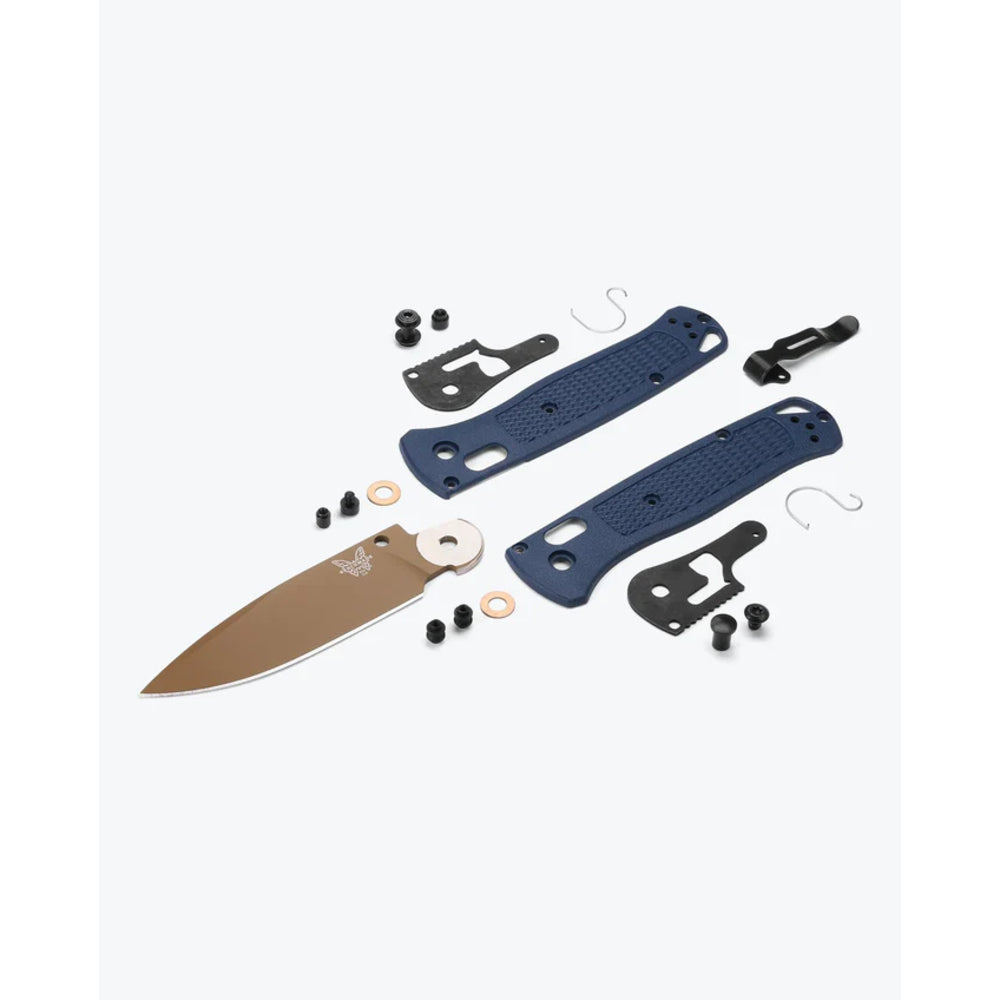 Knife components including blade, sheath, and accessories on a white background