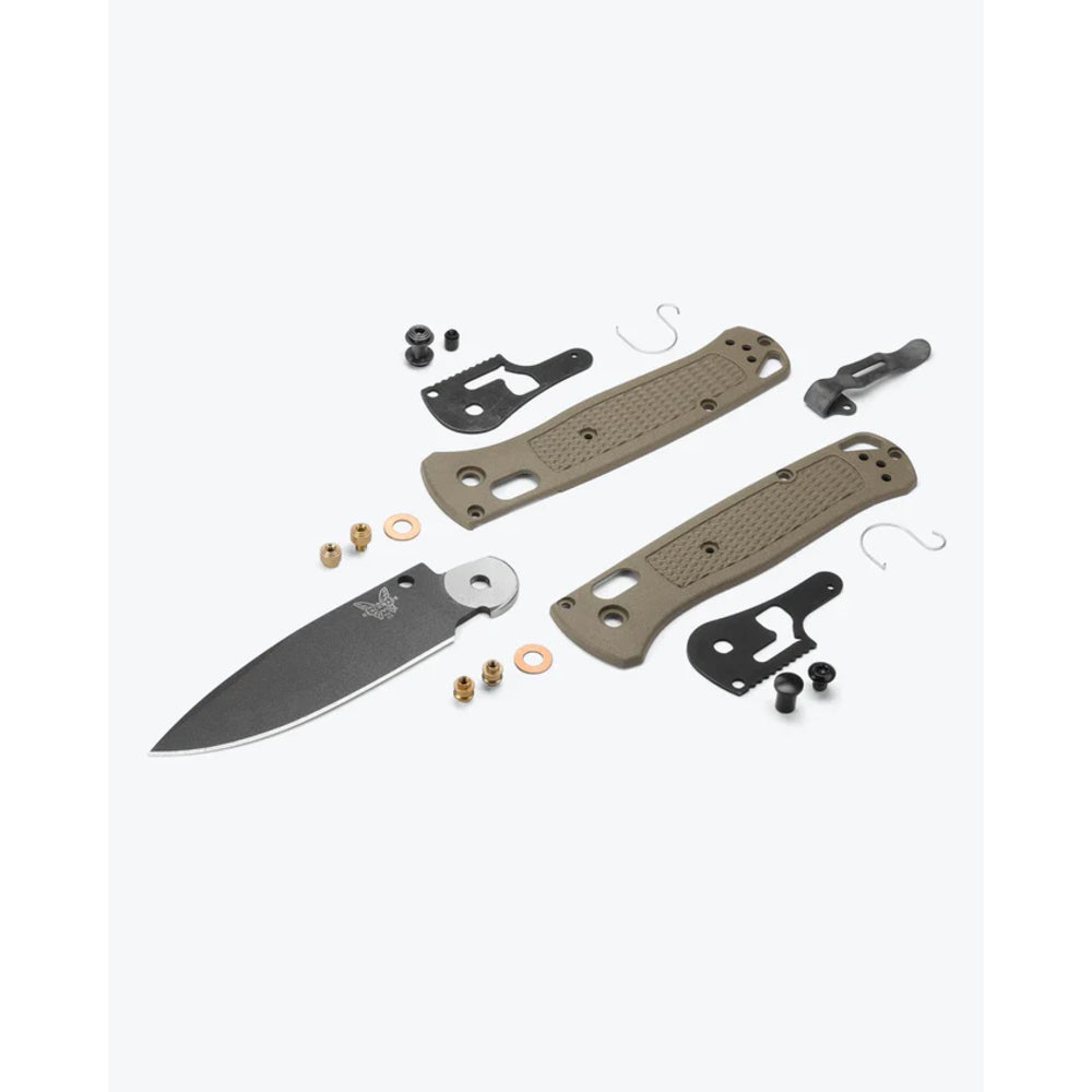 Knife assembly kit with blade, sheath, and various components on a white background