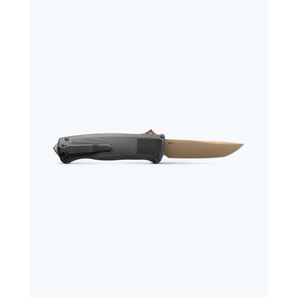 A folding pocket knife with a textured dark gray handle and a tan blade, shown in the open position against a plain white background.
