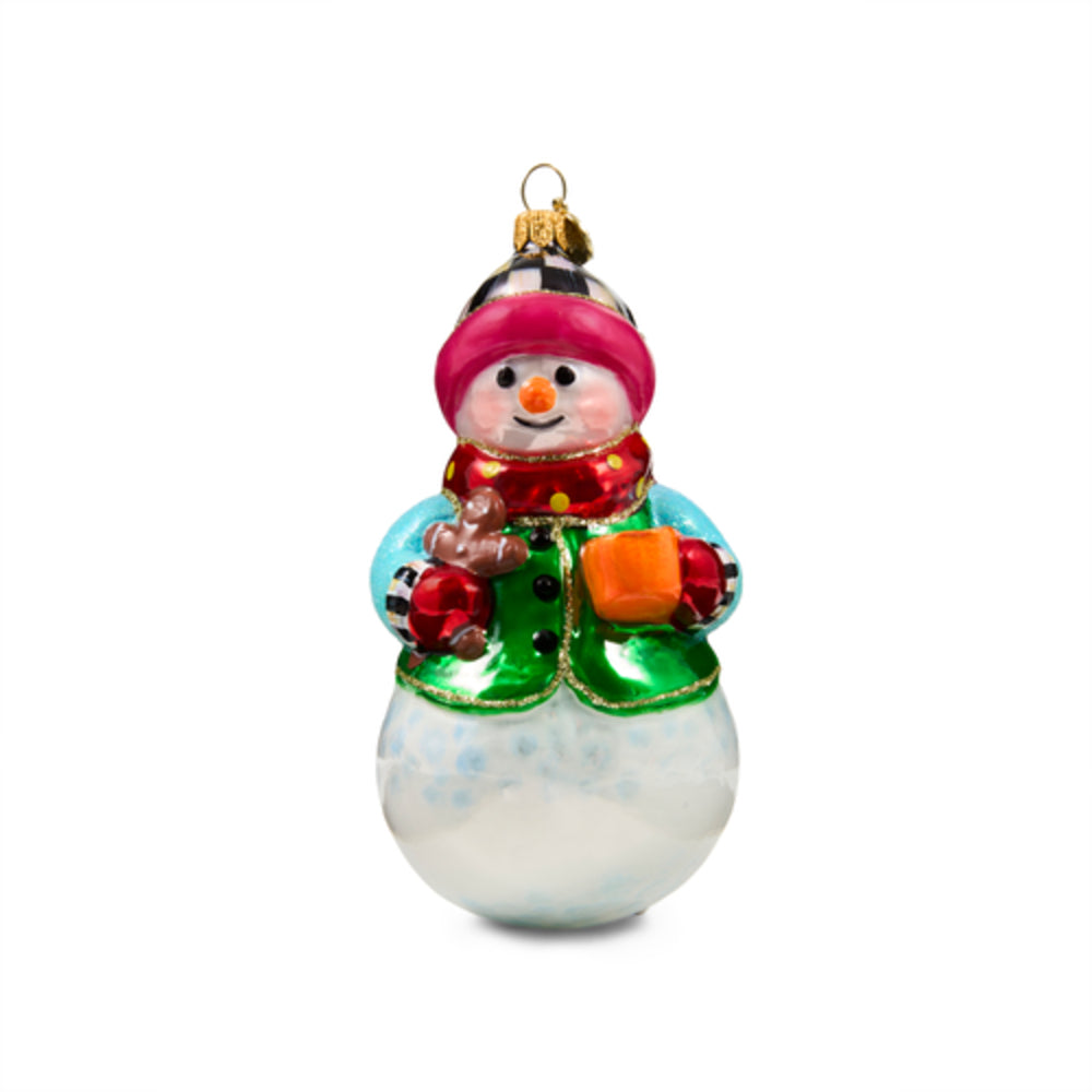 A small snowman Christmas ornament with a white glass body, green boots, a red scarf, and a pink hat, shown on a plain white background.