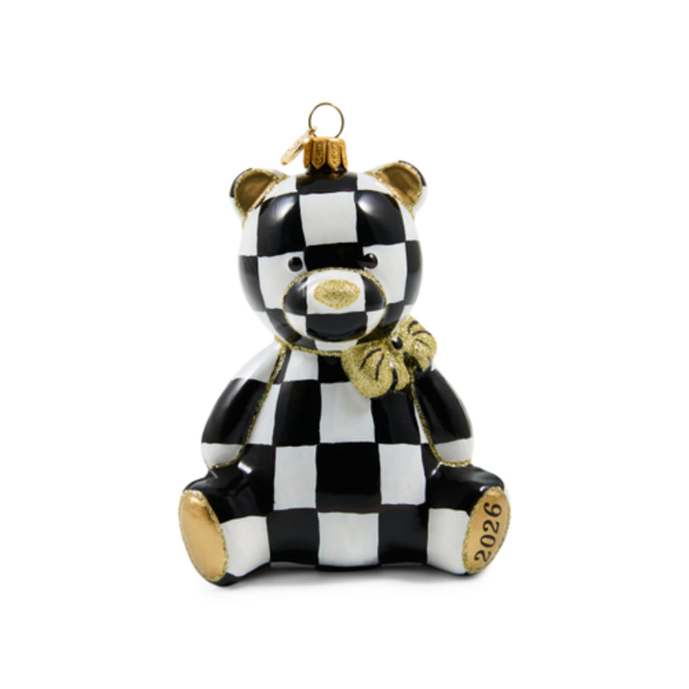 A ceramic teddy bear ornament featuring a black and white checkered pattern with metallic gold accents on the paws, snout, ears, and bow tie, complete with a gold hanging loop at the top.