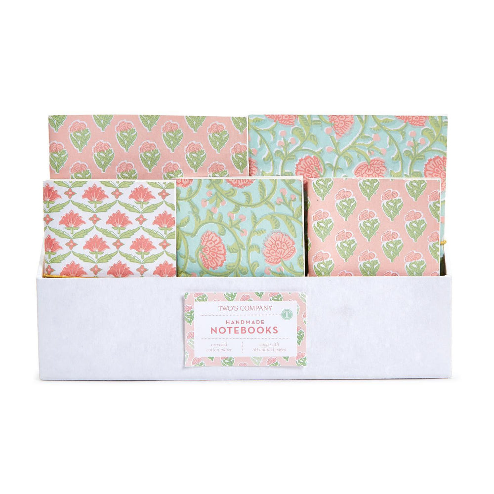 A white box of Twos Company Handmade Notebooks with three different floral and botanical patterned notebooks visible in a two-by-three arrangement.
