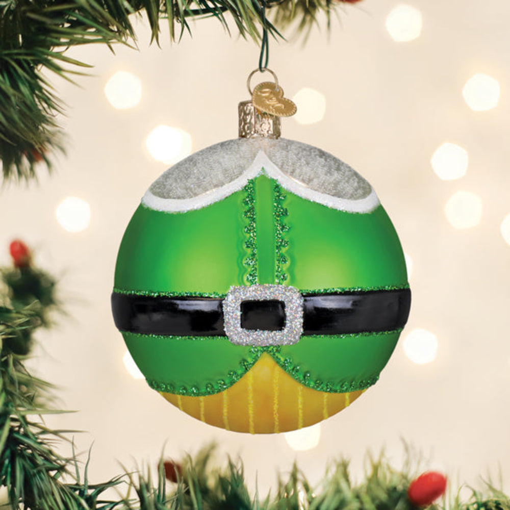 Green glass ornament with a belt buckle on a Christmas tree.