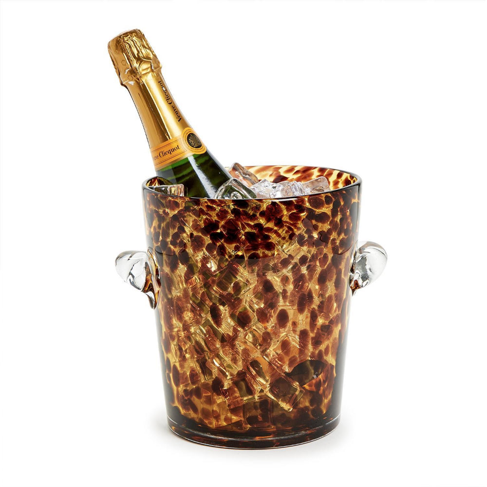 Champagne bottle in a tortoise shell  ice bucket on a white background.