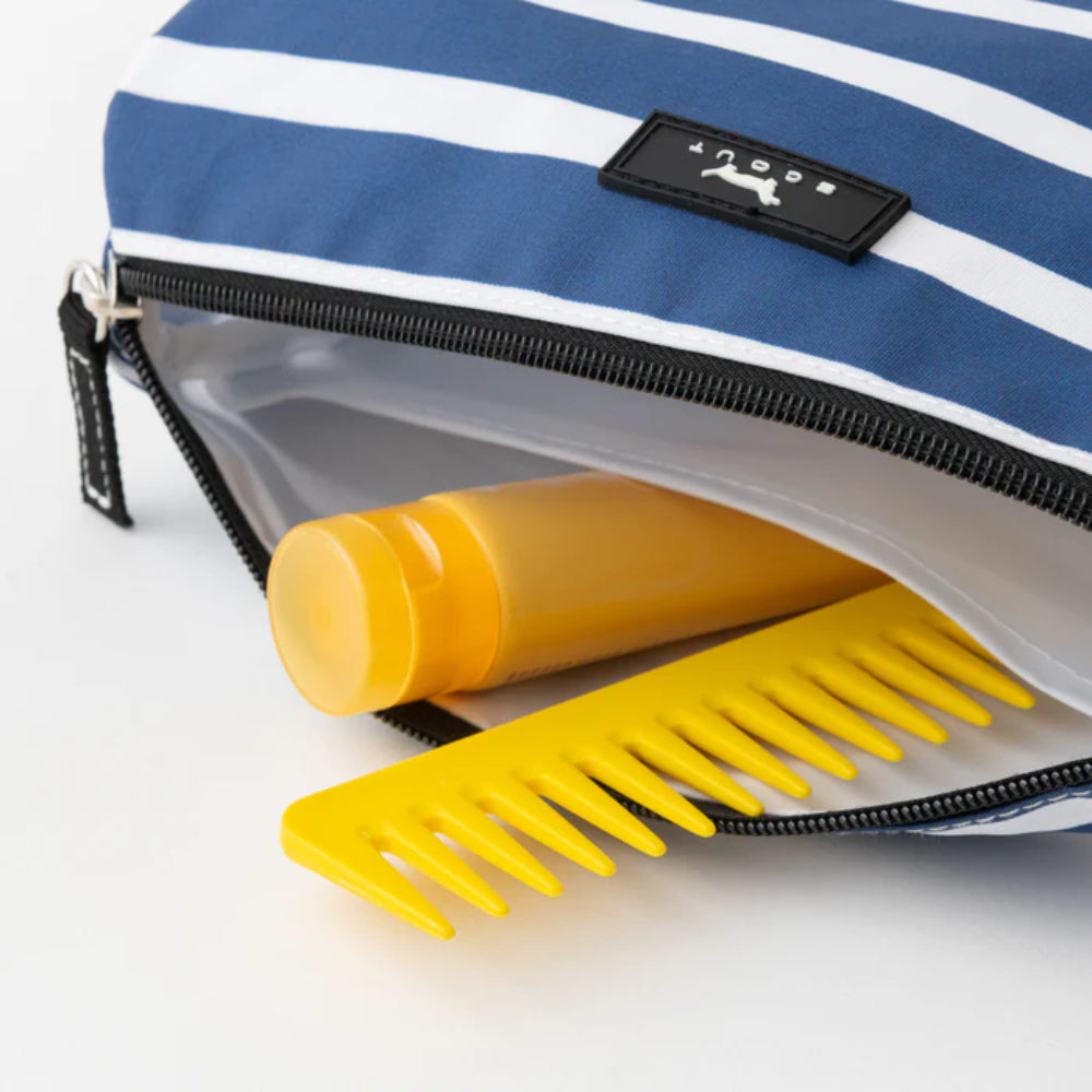 Yellow comb and bottle in a blue and white striped pouch with a brand logo.