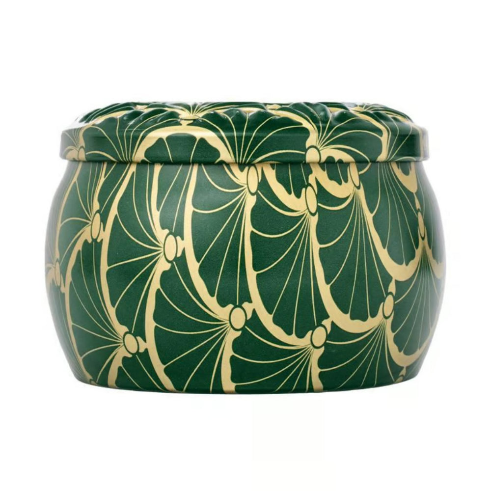 Side of a green tin candle with gold decorative pattern on a white background.