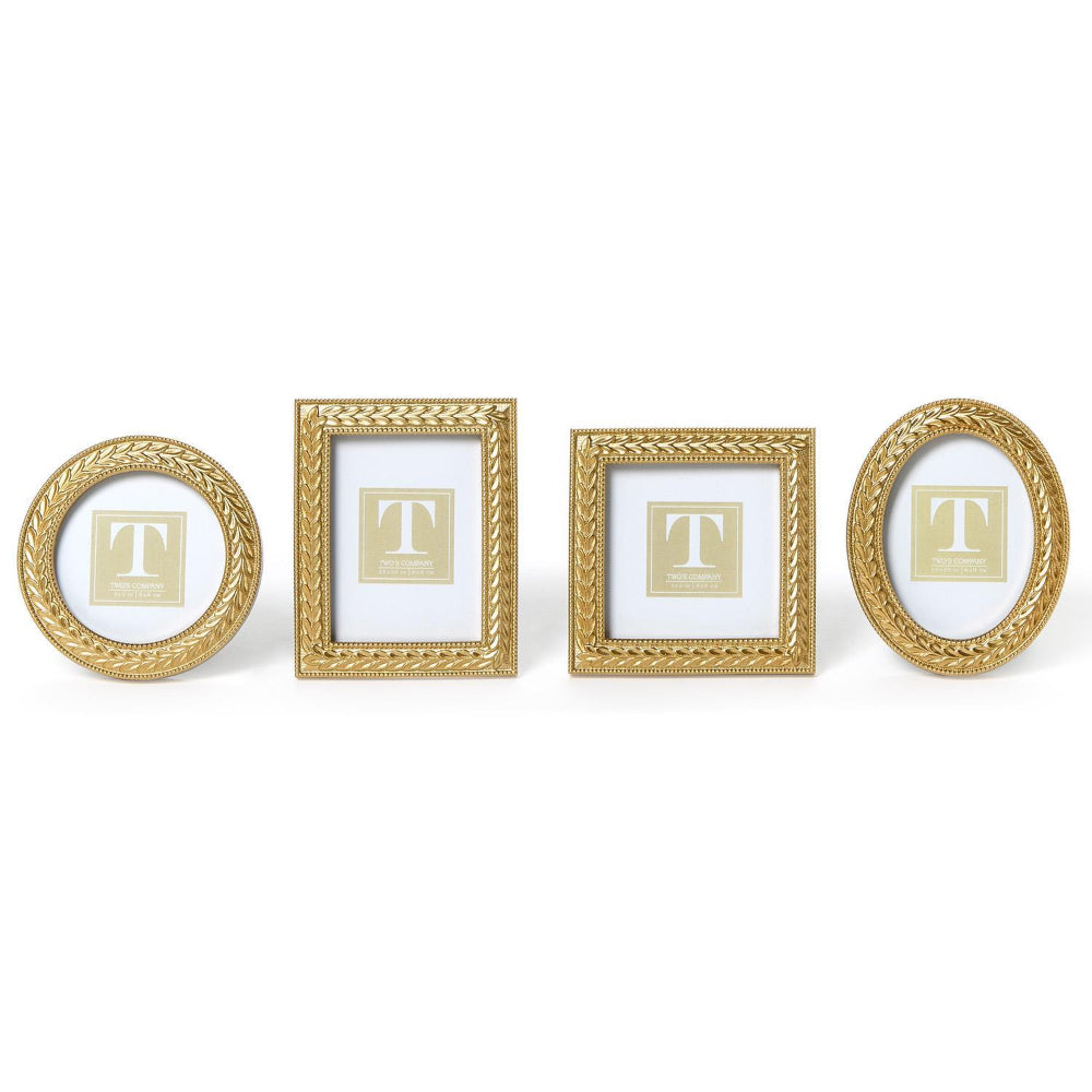 Four gold picture frames in four differant shapes: Oval, Rectangle, Round & square on a white background.