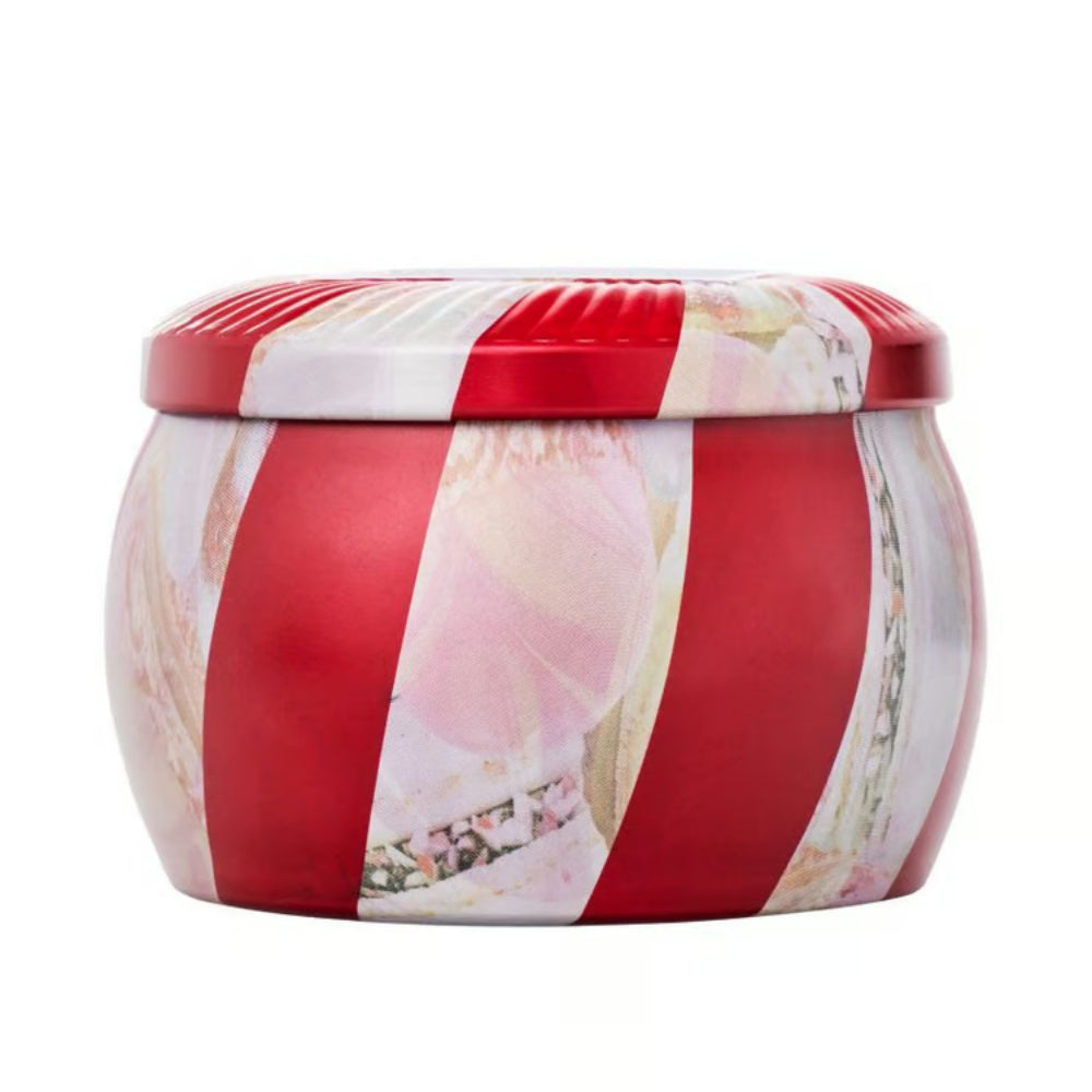 Side of a tin candle jar with red and white striped pattern on a white background.