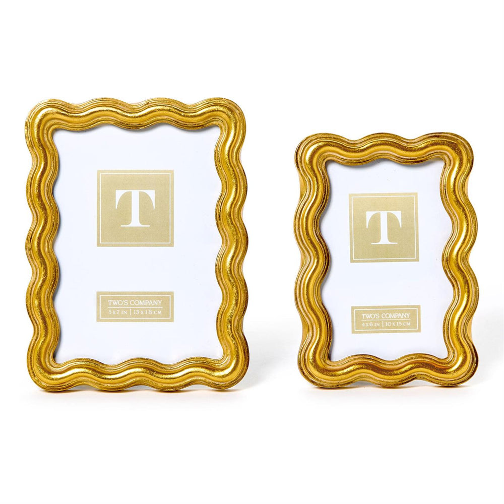 Two gold wave edged picture frames  in 4x6 & 5x7 on a white backround. 