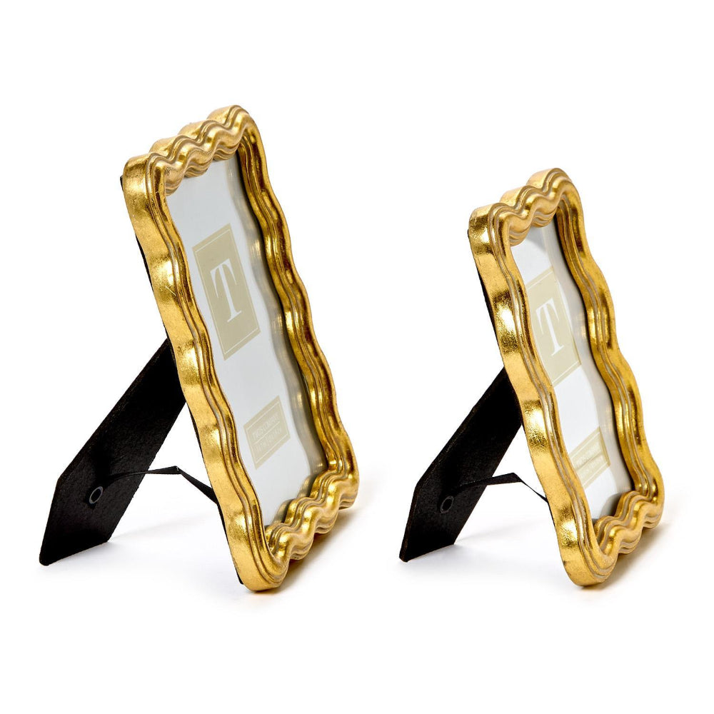 A side photo of two gold wave edged picture frames  in 4x6 & 5x7 on a white backround. 