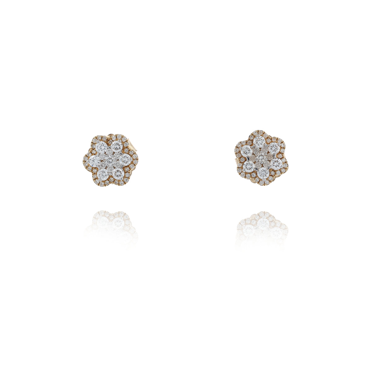 A pair of gold flower-shaped stud earrings set with multiple round-cut clear gemstones, displayed on a clean white background with a soft reflection below.
