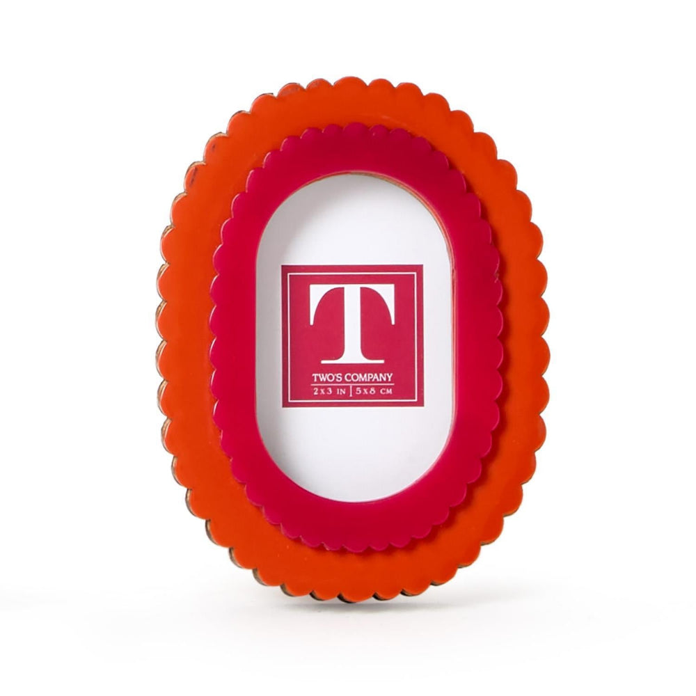 Red and orange scalloped photo frame with 'TWO'S COMPANY' logo on a white background.