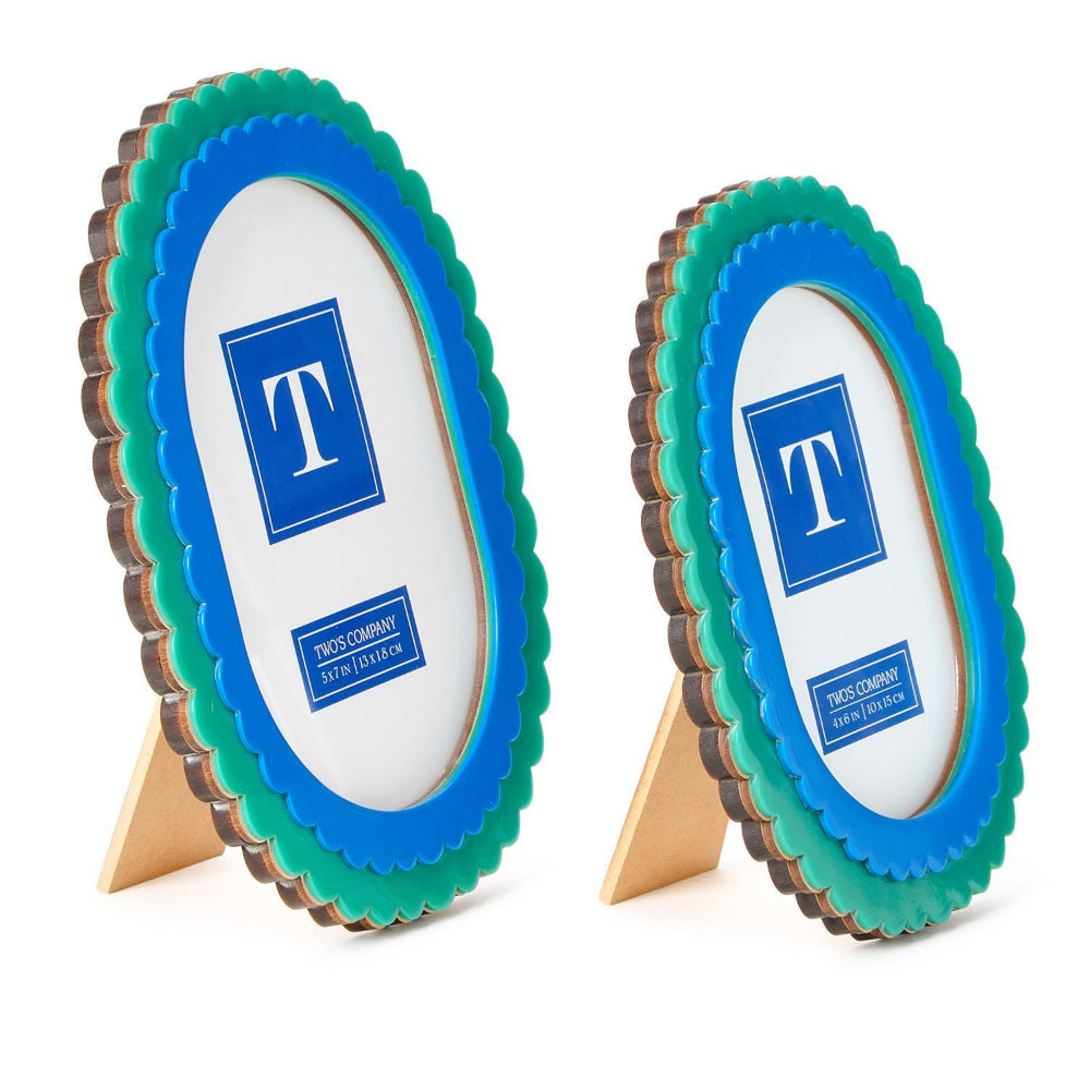 A side photo of two oval picture frames in  5x7 & 4x6  with blue centers and green outer rims on a white background.