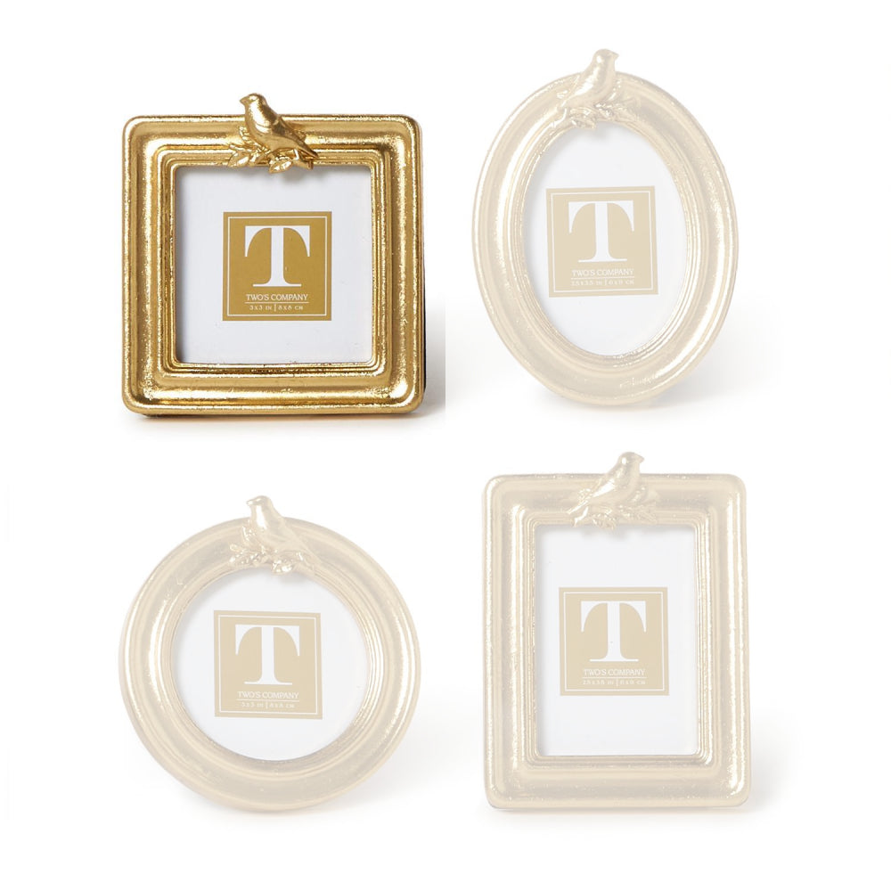 Square gold picture frame with a gold bird on the top  a white background.