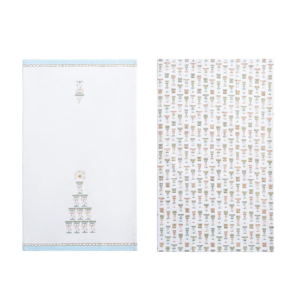 Two blue and white patterned towels on a white background.