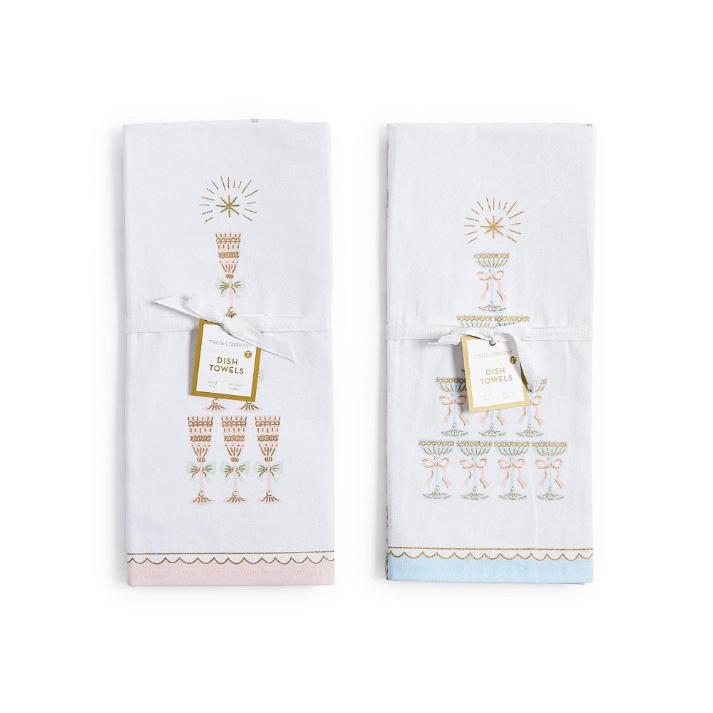Two dish towels with gold and white designs on a white background.