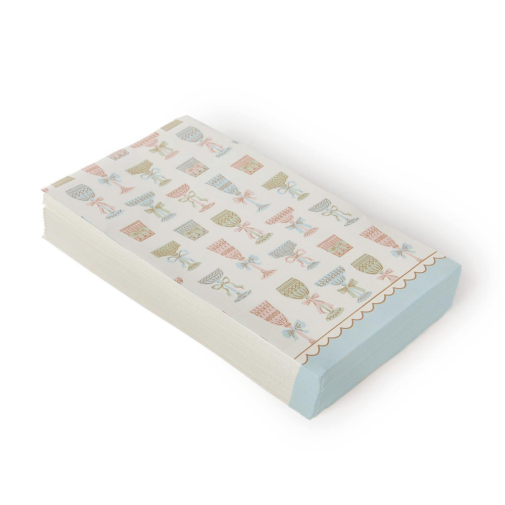 Rectangled Cocktail napkins with decorative colorful wine bottle designs and a bottom blue & white  scalloped edge on a white background.