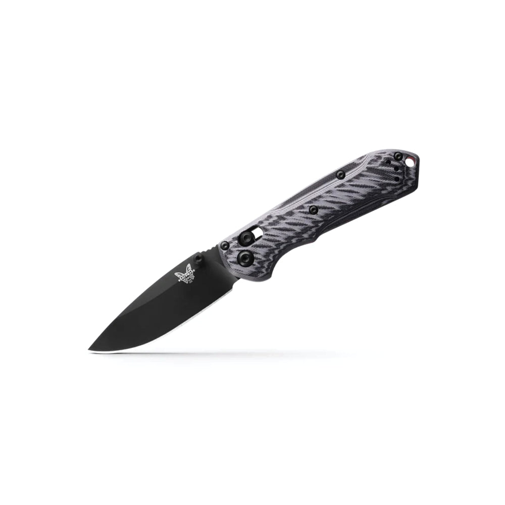 A folding pocket knife with a black drop-point blade and a textured black and gray handle, shown open against a plain white background.