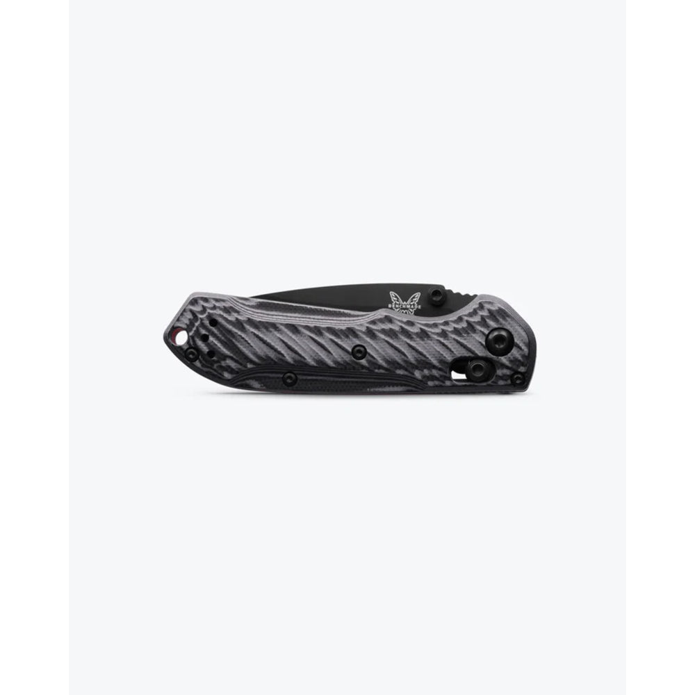 A folding pocket knife with a textured black and gray handle, shown partially open against a plain white background.