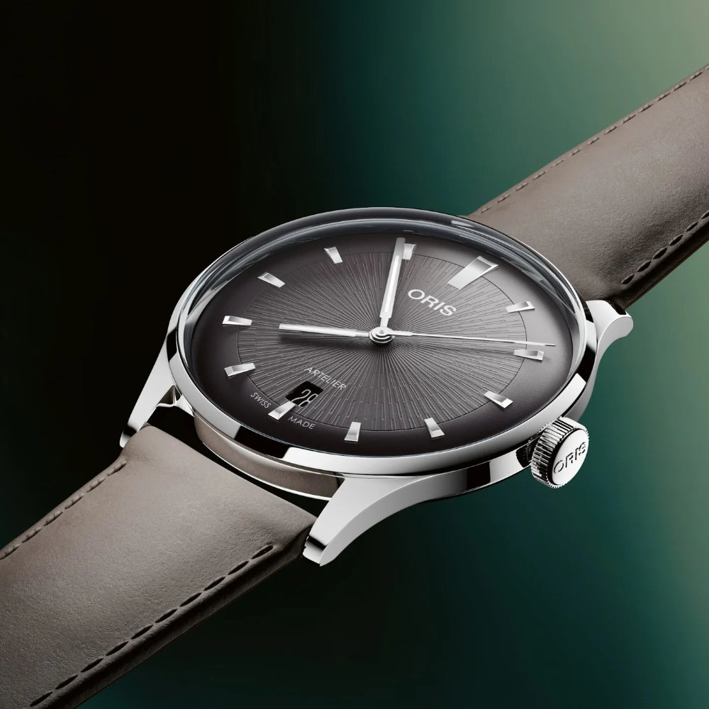 Oris watch with brown leather strap on a gradient background