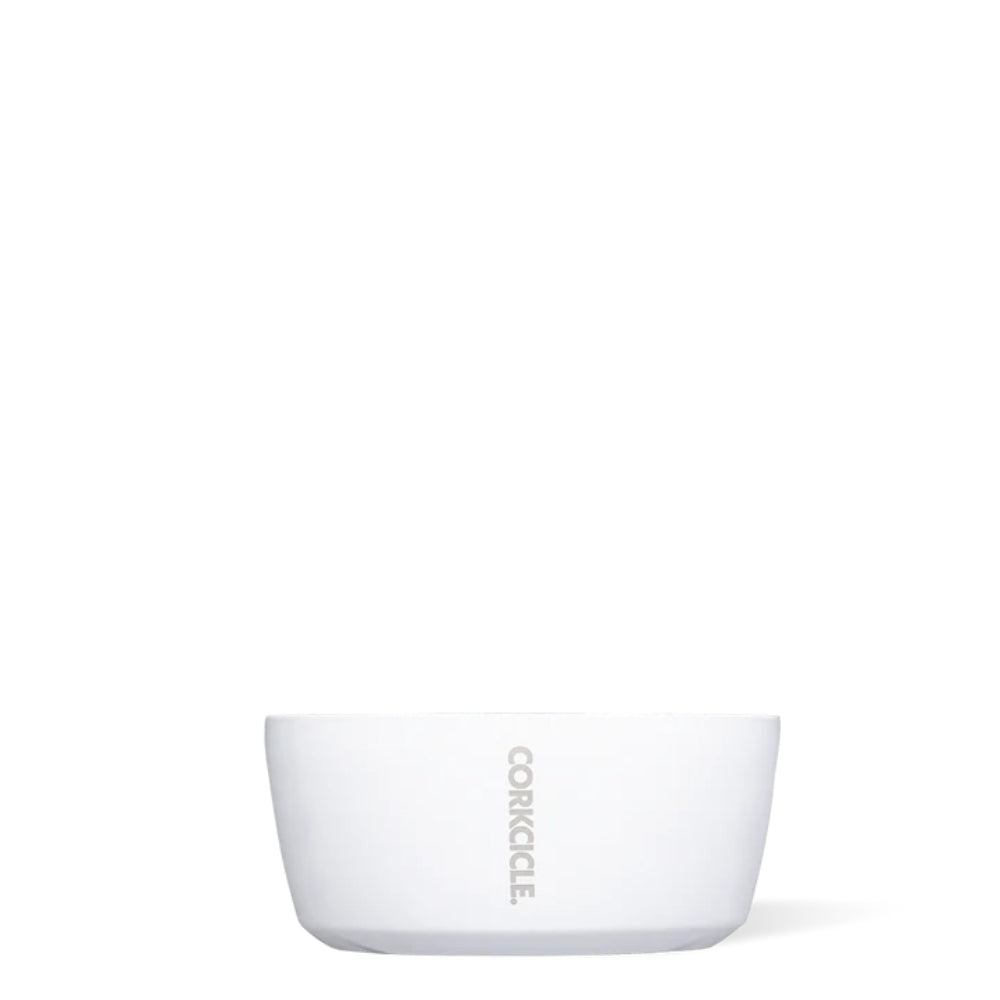 A gloss white, double-walled stainless steel dog bowl with a non-slip bottom, branded with 'Corkcicle'.