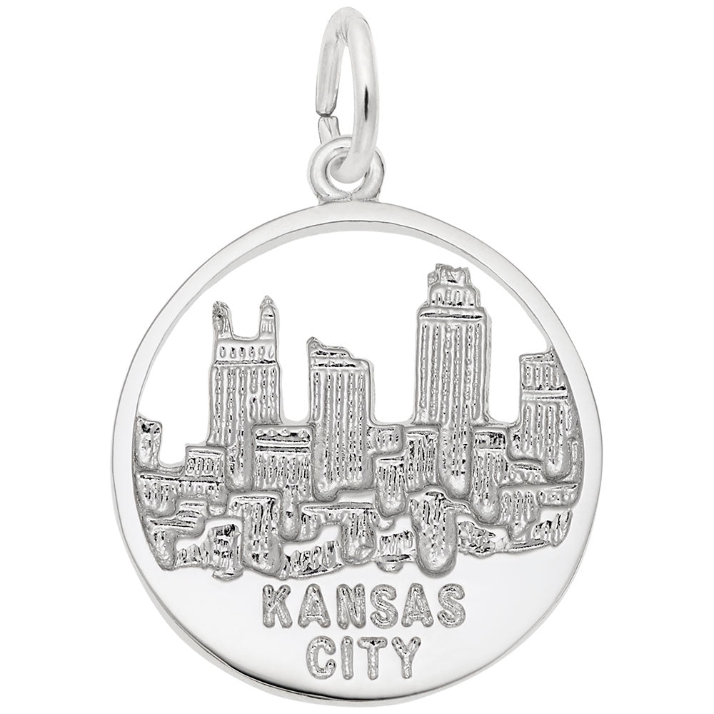 Silver charm with Kansas City skyline design on a white background