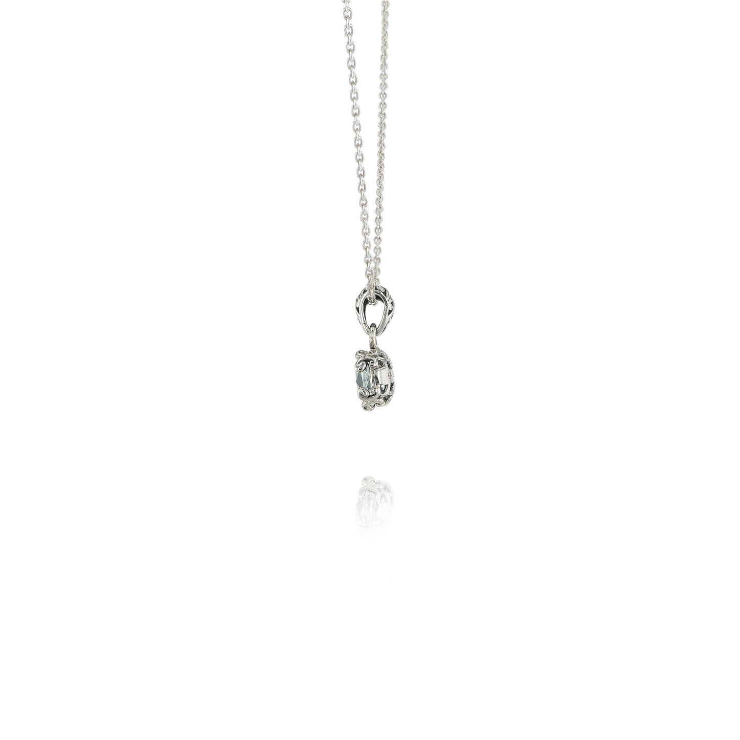 Side view of a Silver necklace with a White Topaz pendant on a white background