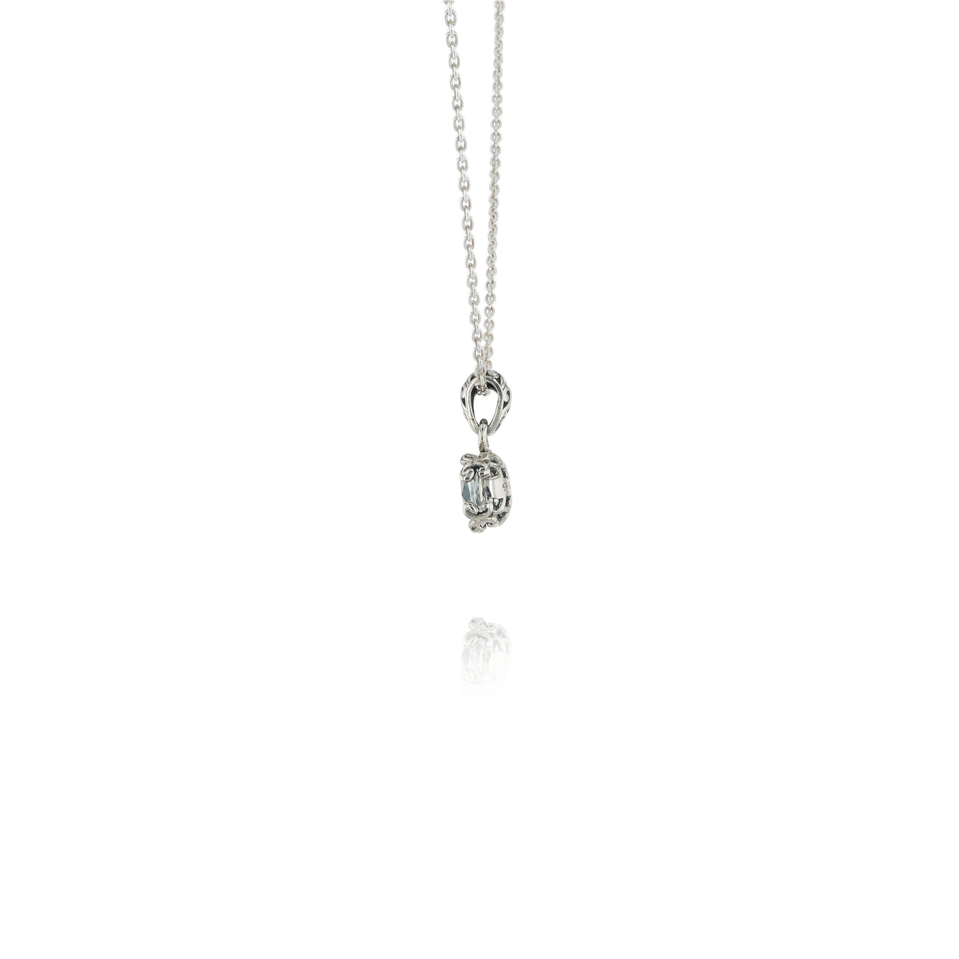 Side view of a Silver necklace with a White Topaz pendant on a white background
