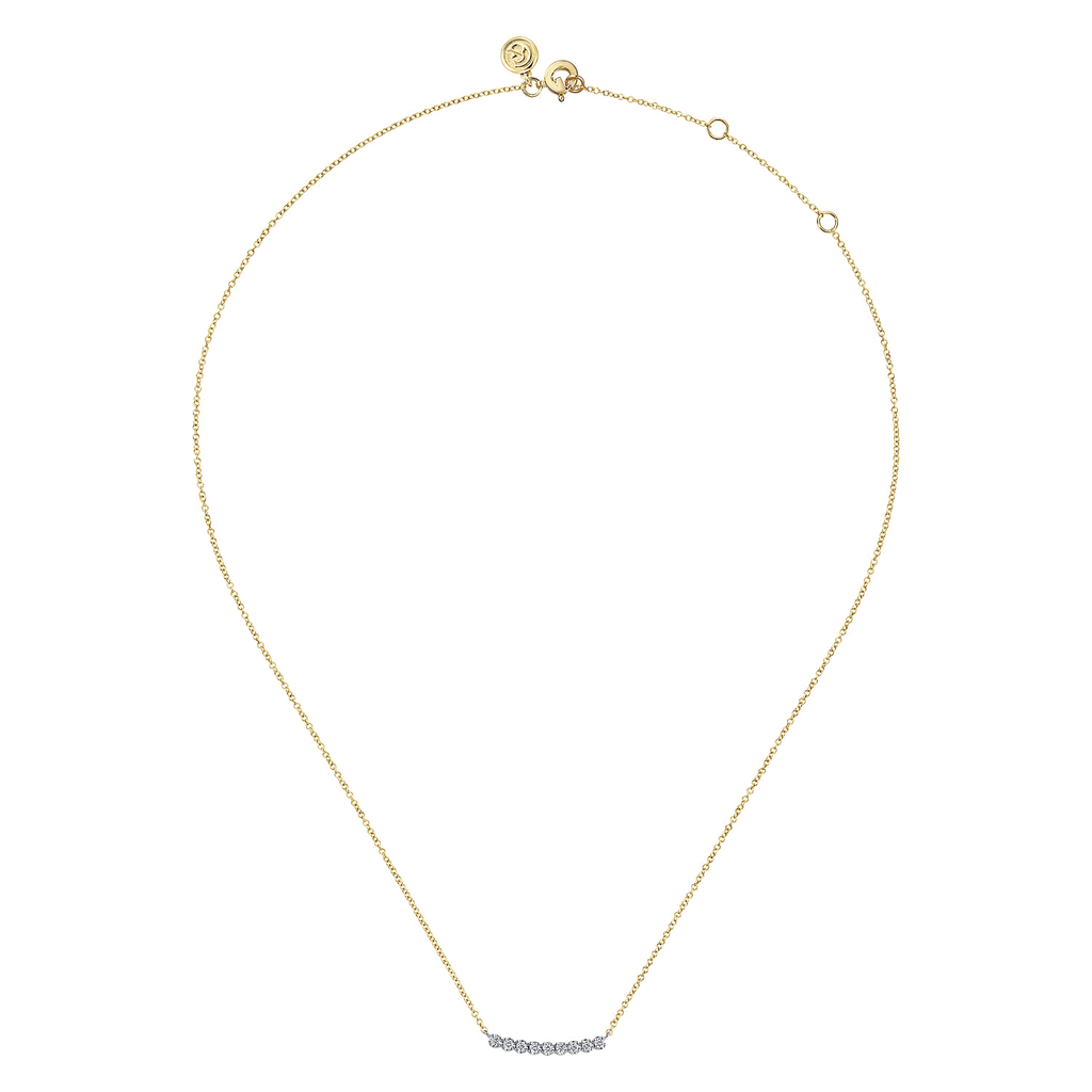 gold necklace on white background