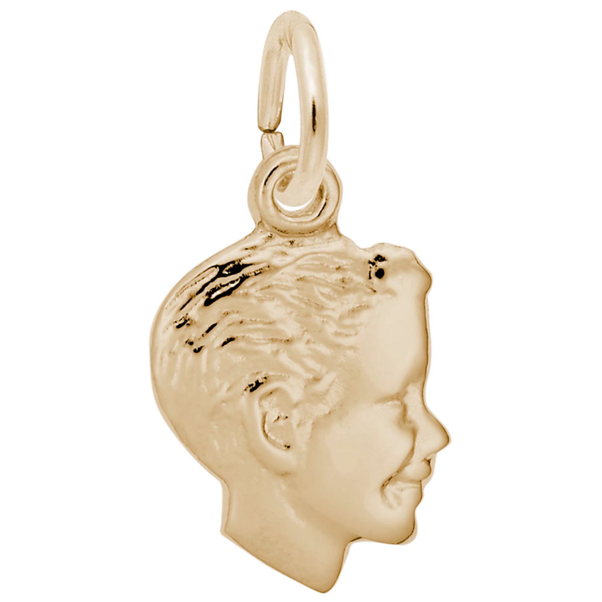 Gold charm of a profiled face on a white background