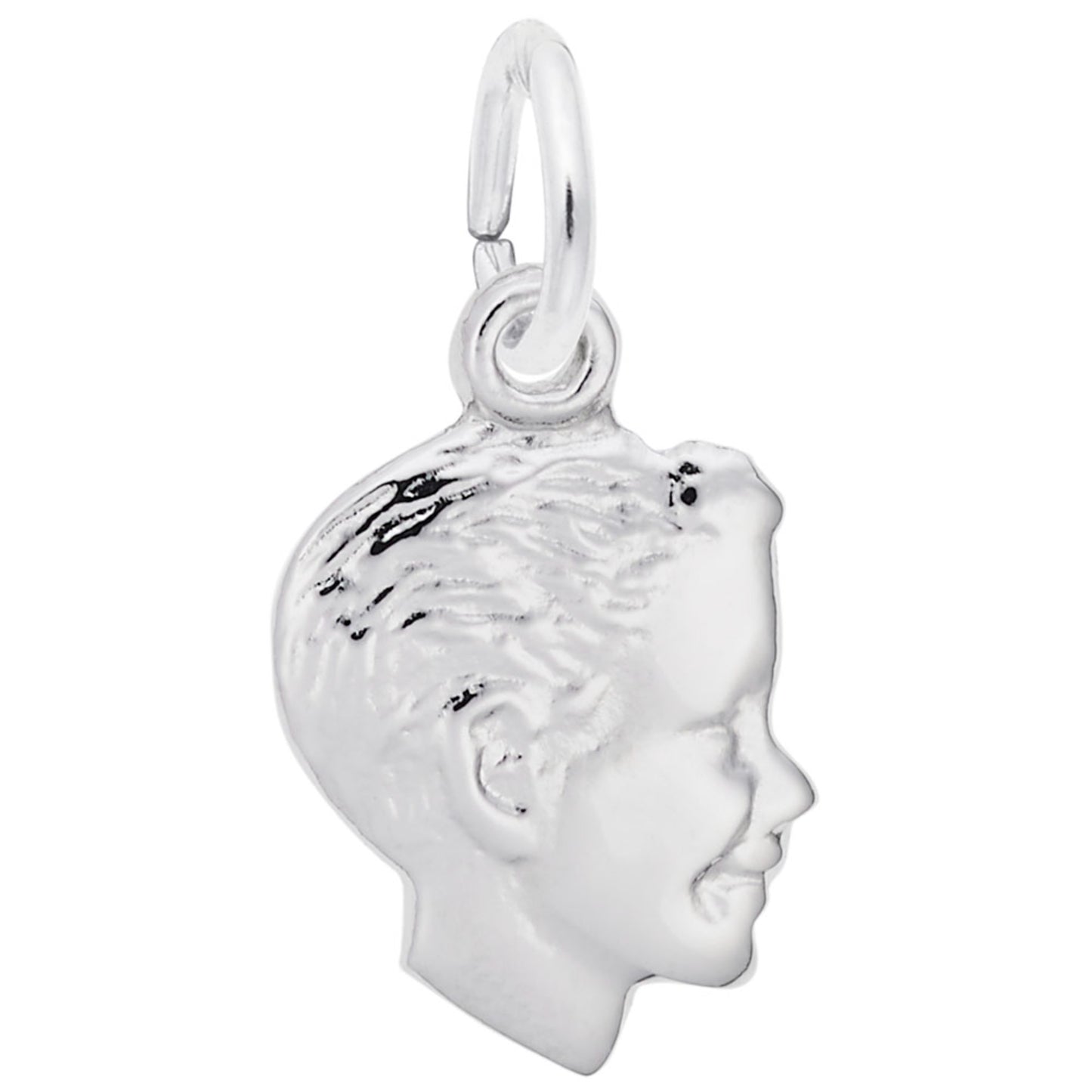 Silver charm of a profiled face on a white background