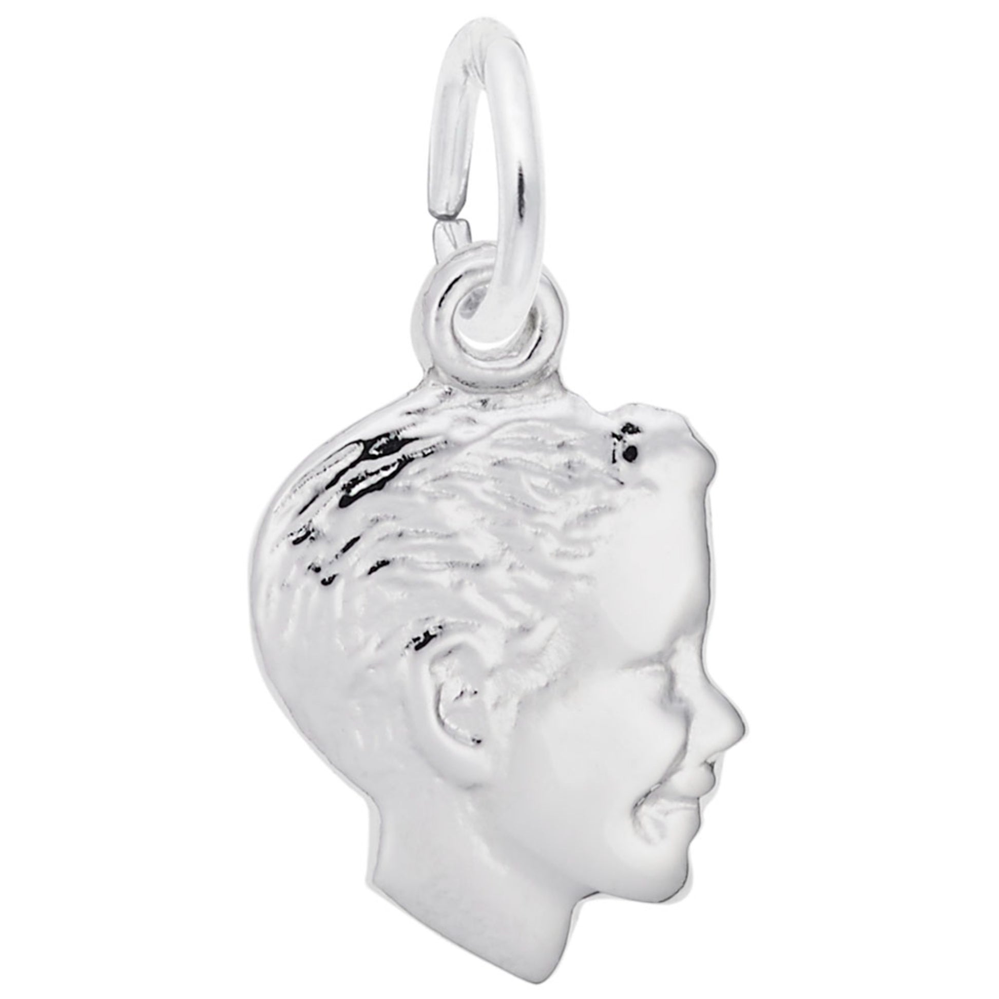 Silver charm of a profiled face on a white background