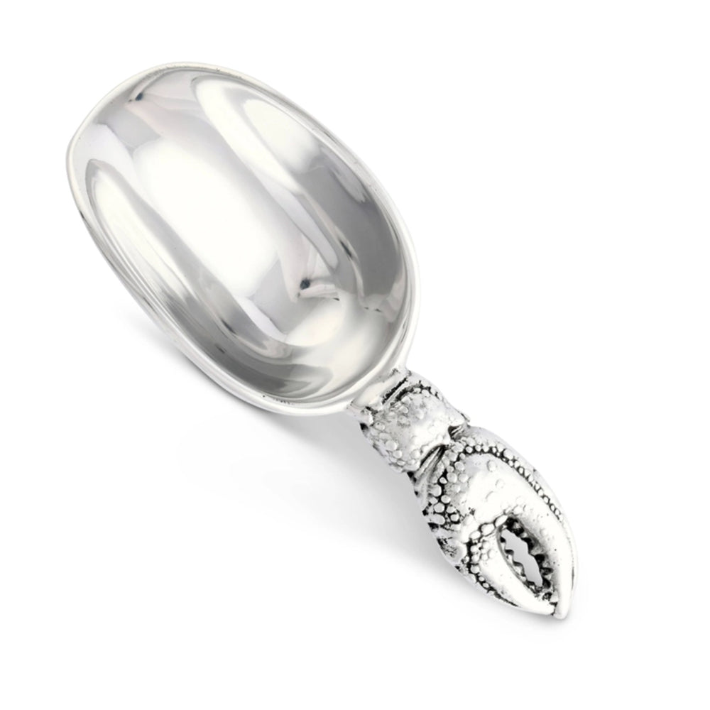 Silver spoon with a claw handle on a white background