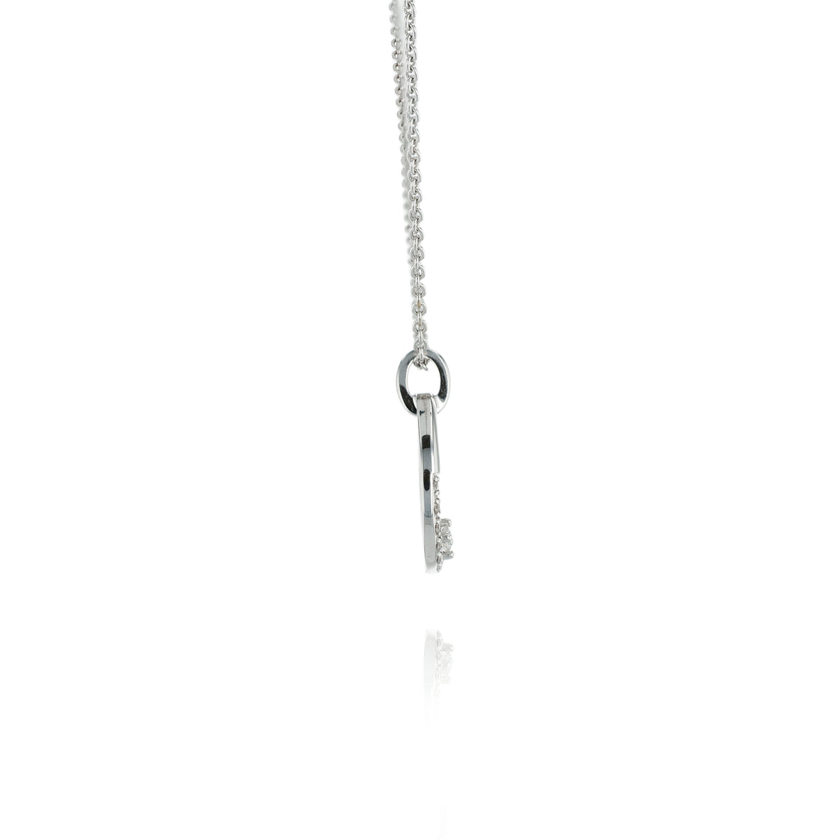 A white gold chain necklace with a circular pendant featuring a small crown motif and clear stones, shown on a white background with a faint reflection below.