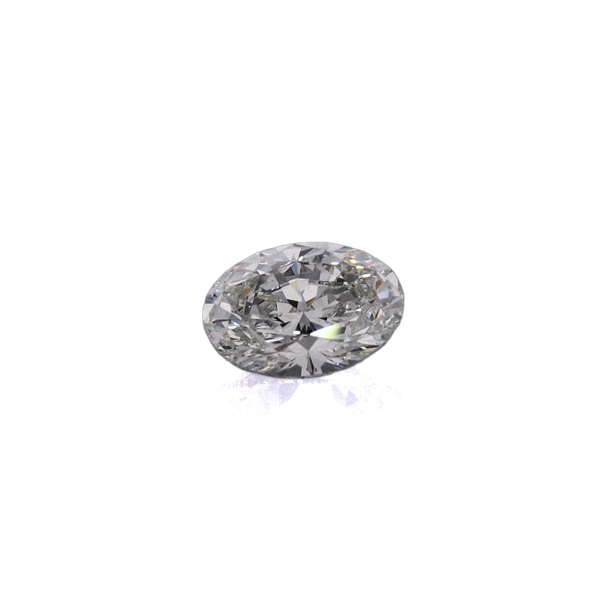 An oval-cut diamond gemstone with a brilliant faceted cut, displayed on a clean white background with a subtle reflection below.