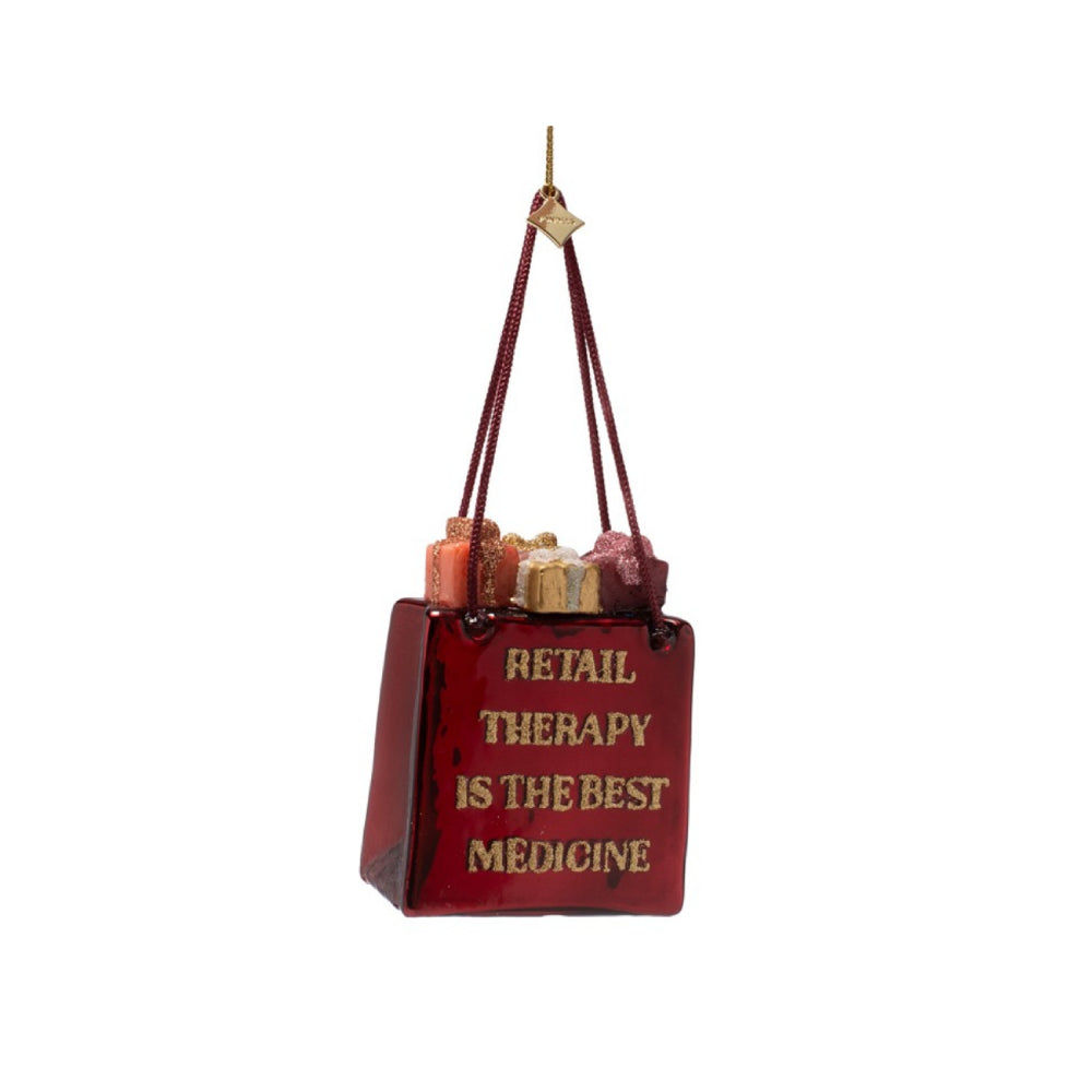Decorative bag with 'Retail Therapy is the Best Medicine' text on a white background