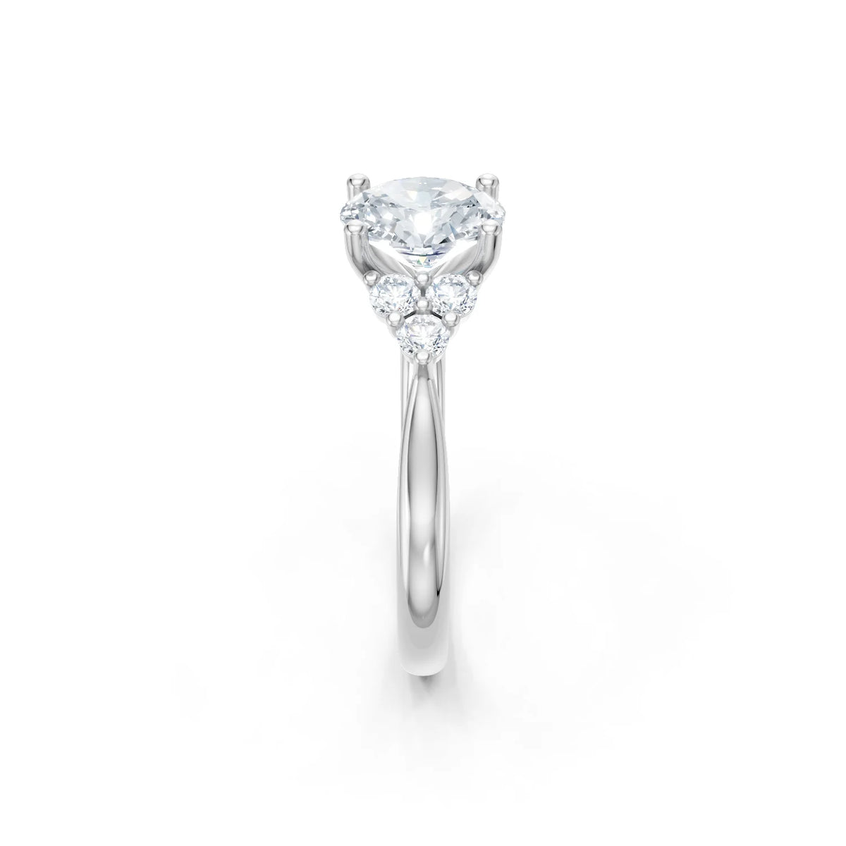 A silver diamond engagement ring featuring a large oval-cut center stone and smaller side stones, set on a polished silver band against a white background.