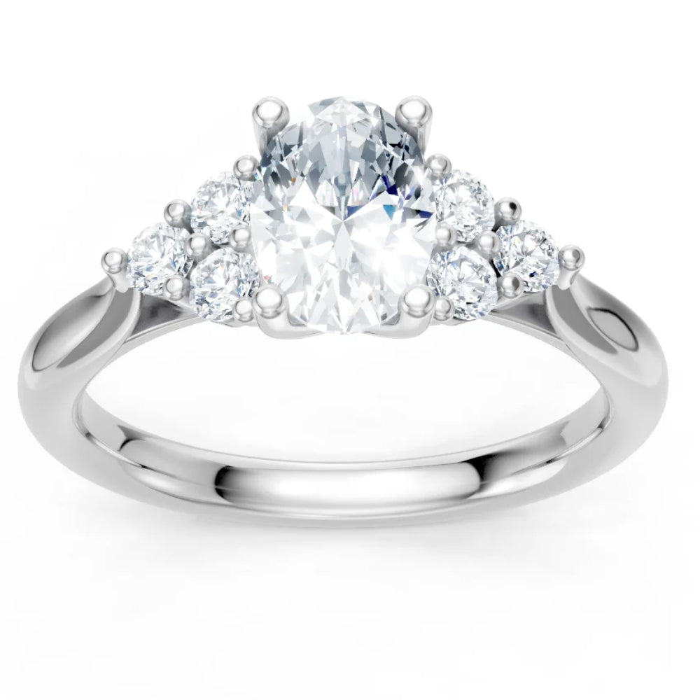 A silver-tone diamond ring with a large oval center stone and smaller round diamonds on either side, shown on a clean white background.