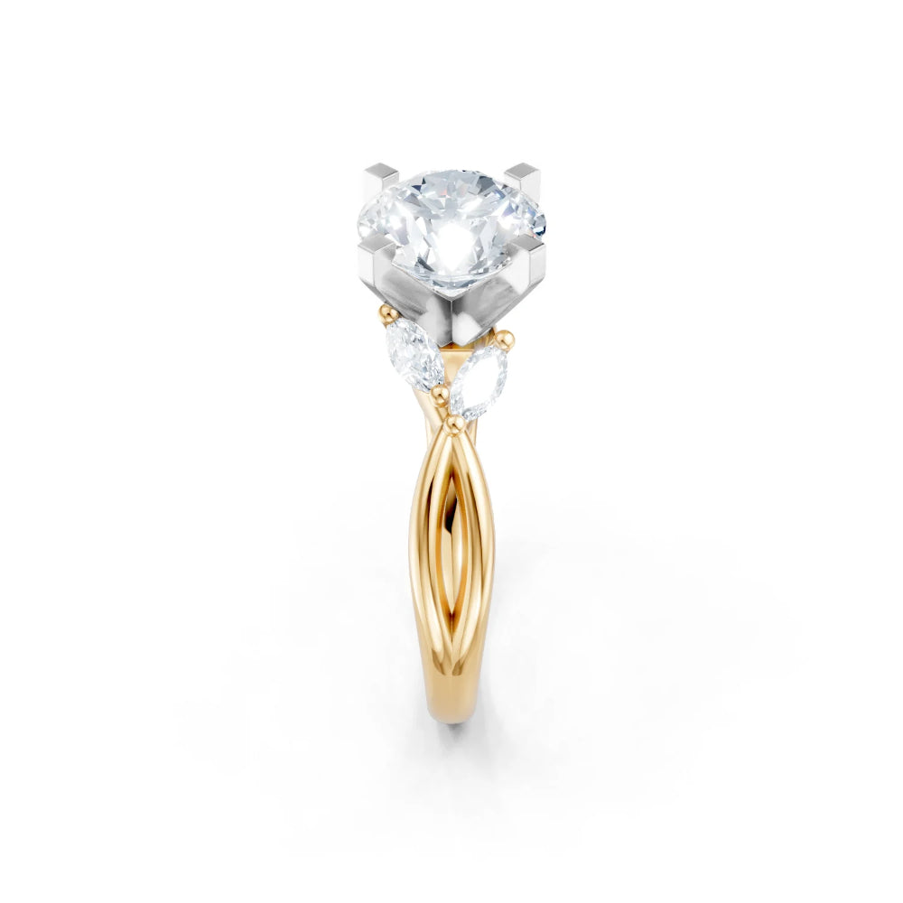 Yellow and white gold ring with a large central gemstone and smaller side stones on a white background