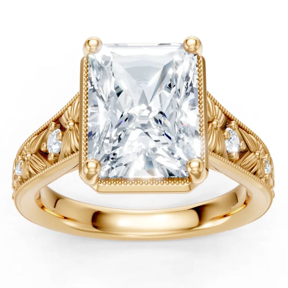 Gold ring with a large diamond and smaller diamonds on the band against a white background
