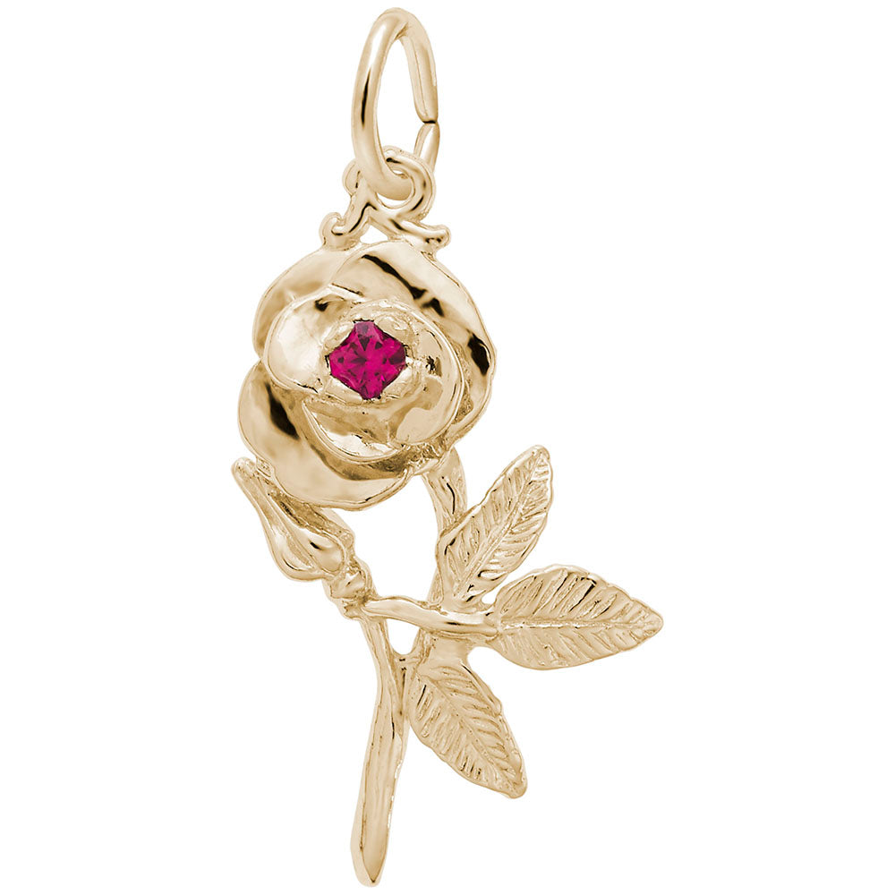 Gold flower shaped charm with a red stone in the center, shown on a white background