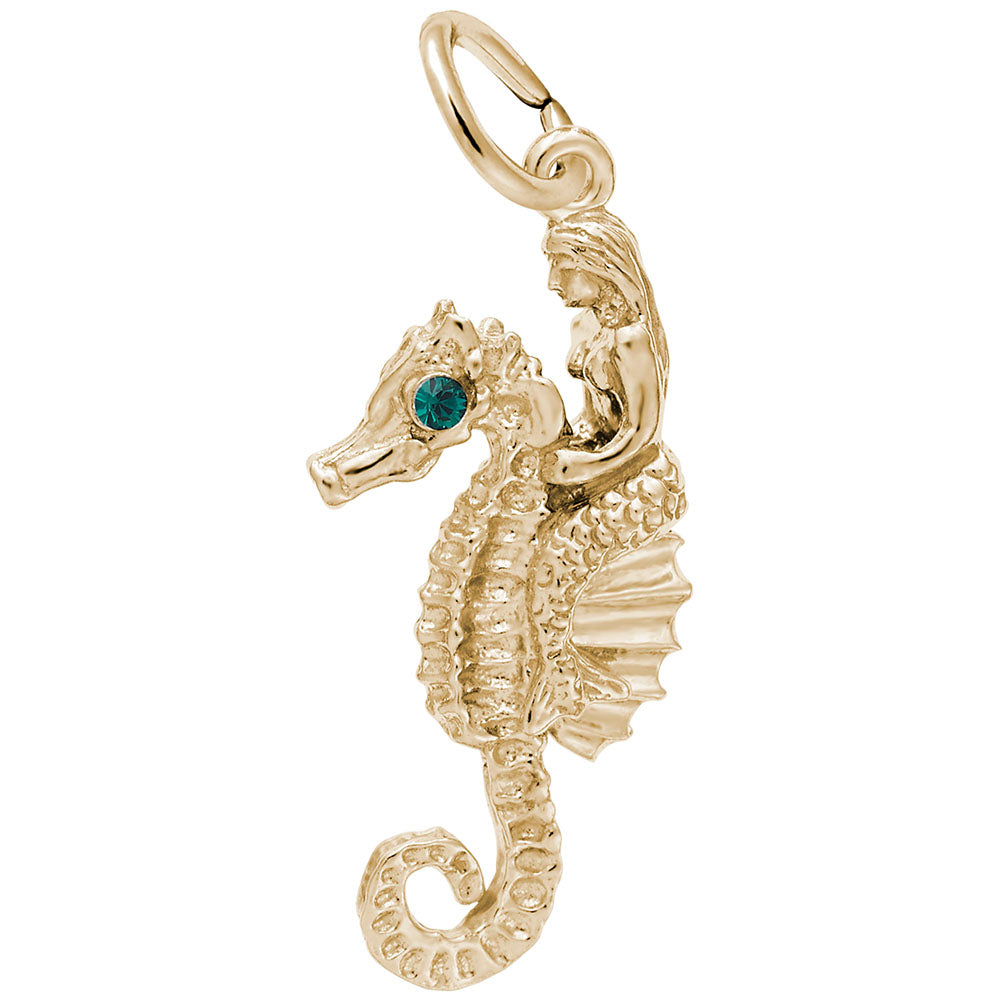 Gold seahorse, with green gemstone eyes, and mermaid charm on a white background