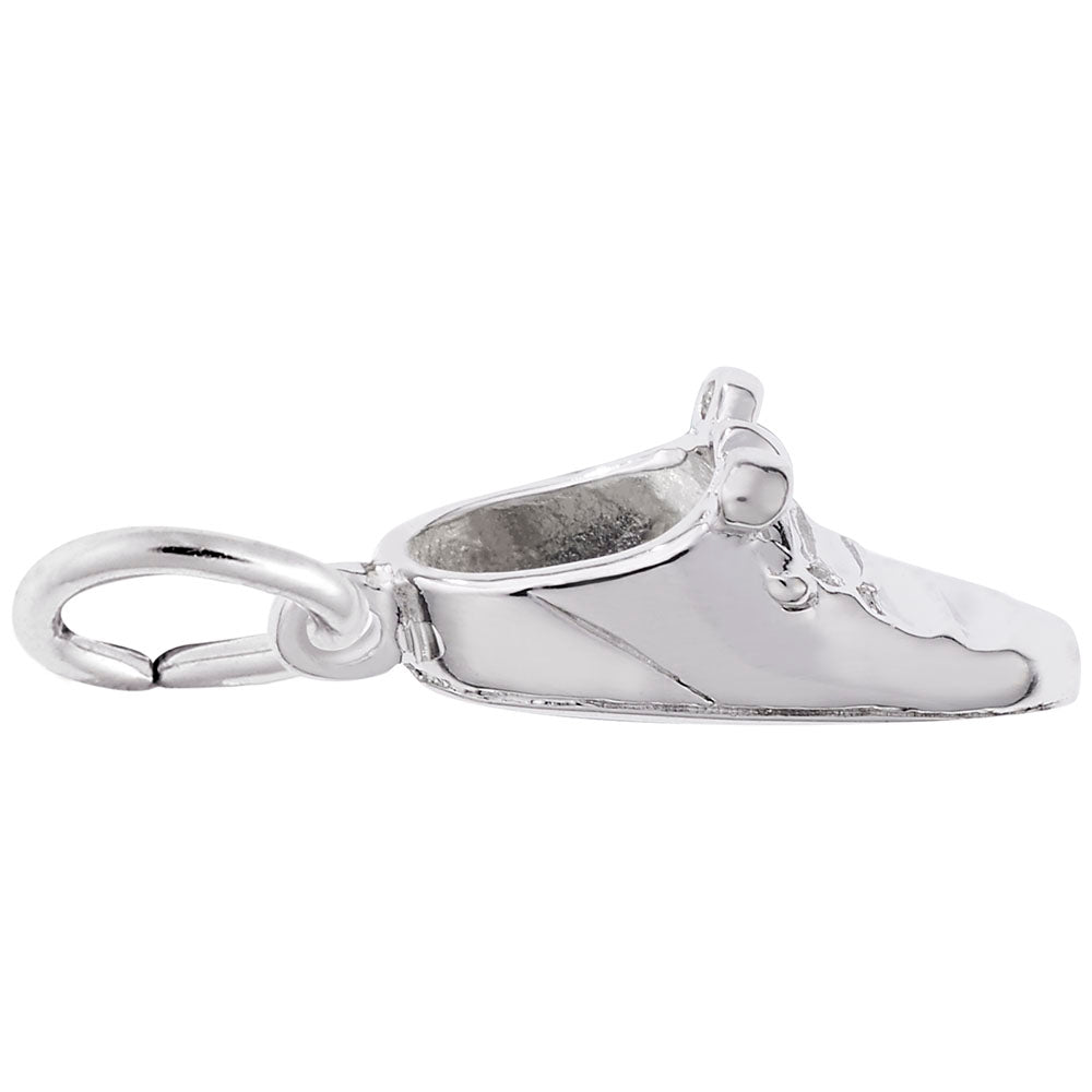 Silver shoe charm on a white background