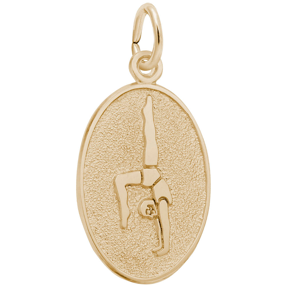 An oval gold charm featuring an engraved silhouette of a gymnast, set against a textured background with a polished border, shown on a plain white background