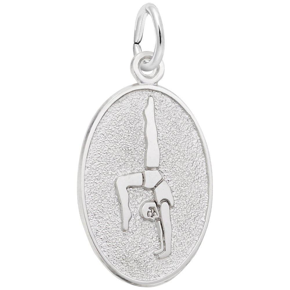 An oval silver charm featuring an engraved silhouette of a gymnast, set against a textured background with a polished border, shown on a plain white background