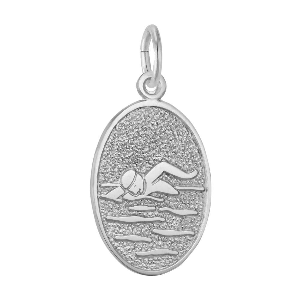 An oval silver charm featuring a textured background with an engraved figure of a swimmer, shown on a plain white background.