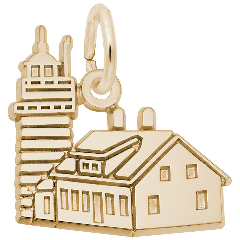 Gold charm shaped like the Quoddy Head Lighthouse with engraved line and window details, shown on a plain white background