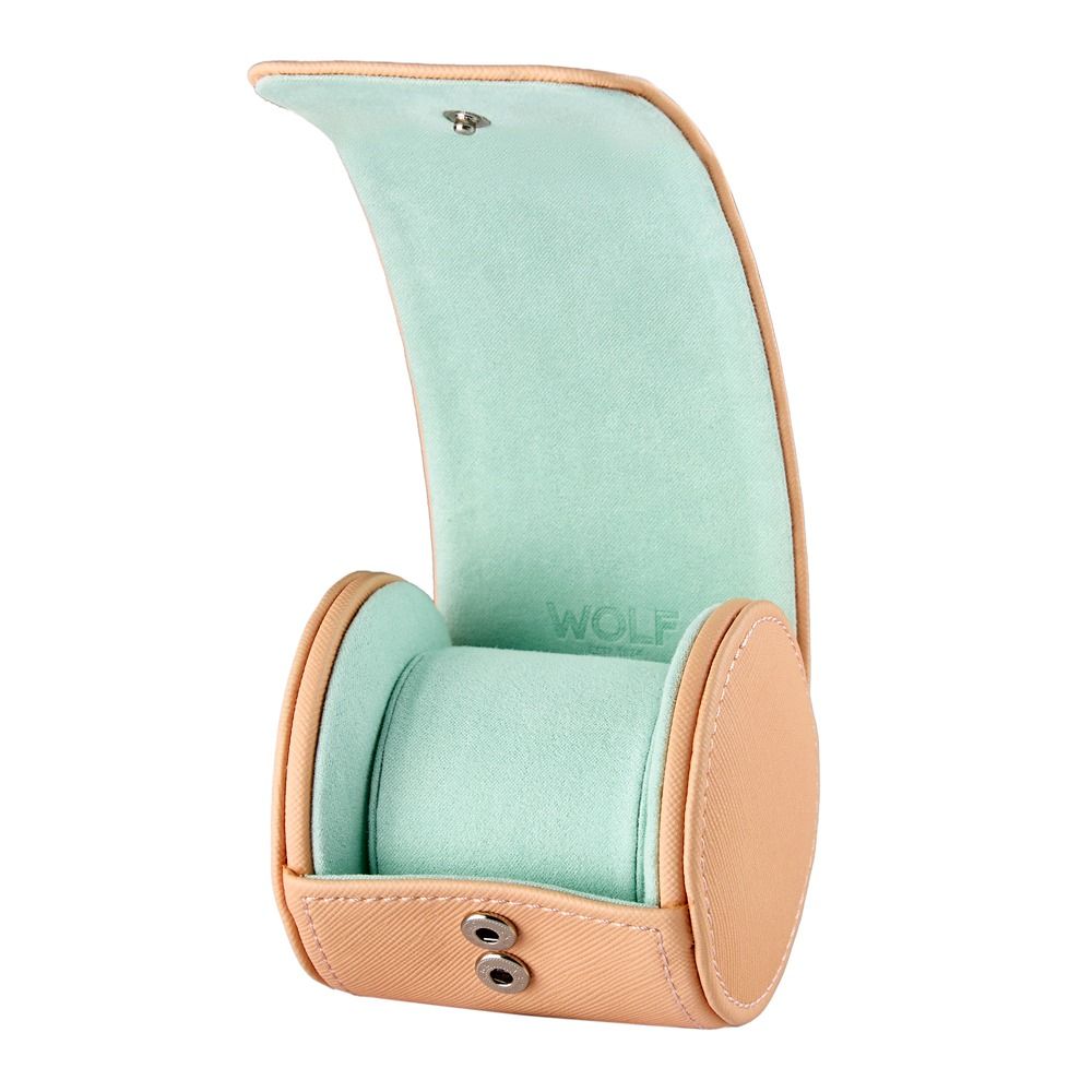 Mint green watch case with beige exterior on a white background